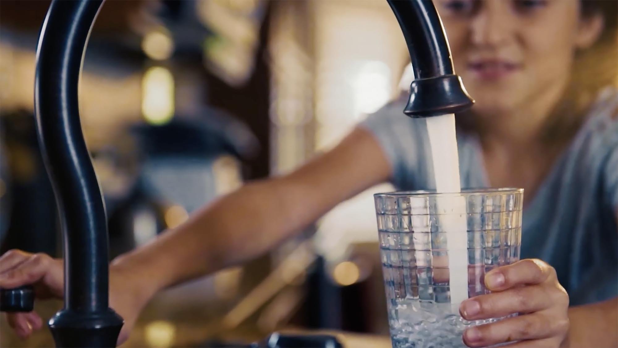 Reliable Water Future. Drinking water from a faucet.
